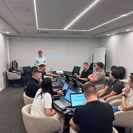 A company team at a Claude training session